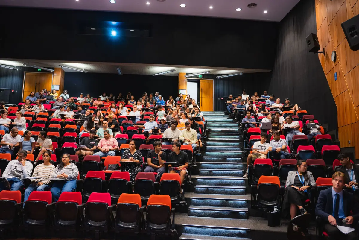 A full lecture theatre at Murdoch University, seen from the stage
