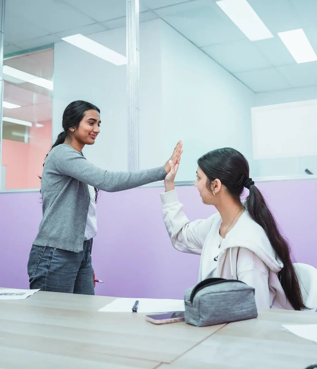 An Everest tutor celebrating with a student